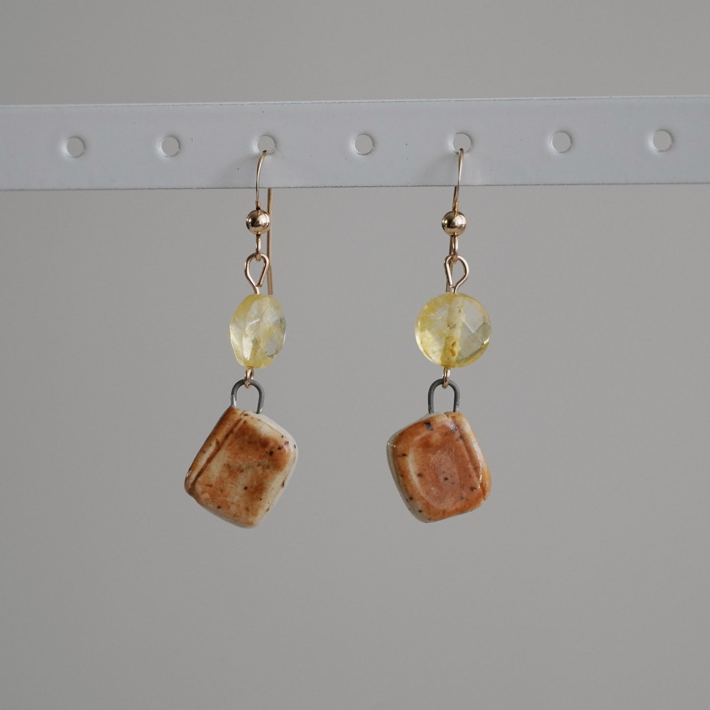 brown book earrings